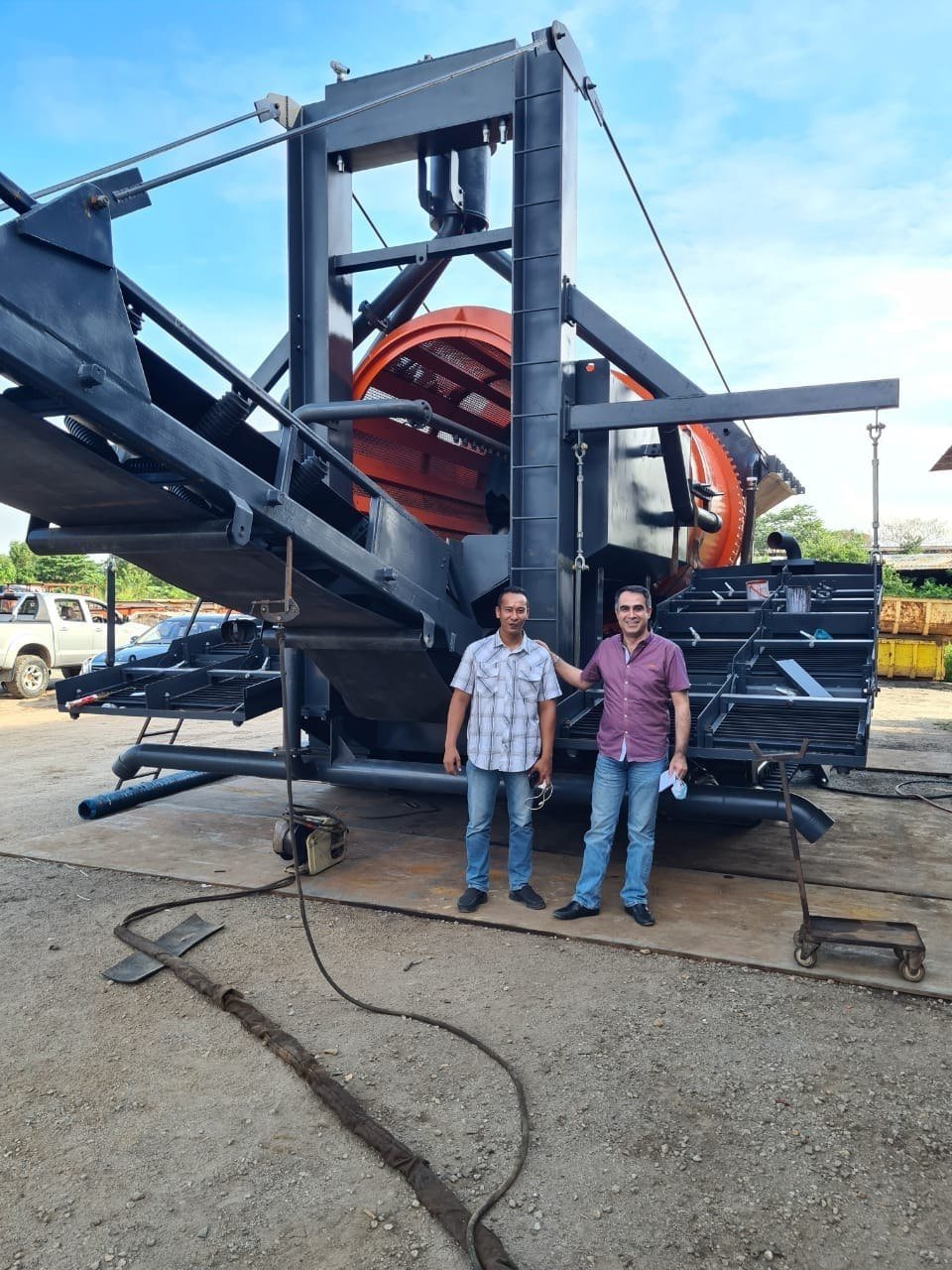 Two engineers stood in front of a finished plant before shipping